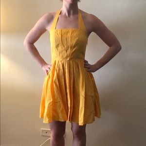 Yellow summer dress with pleated skirt